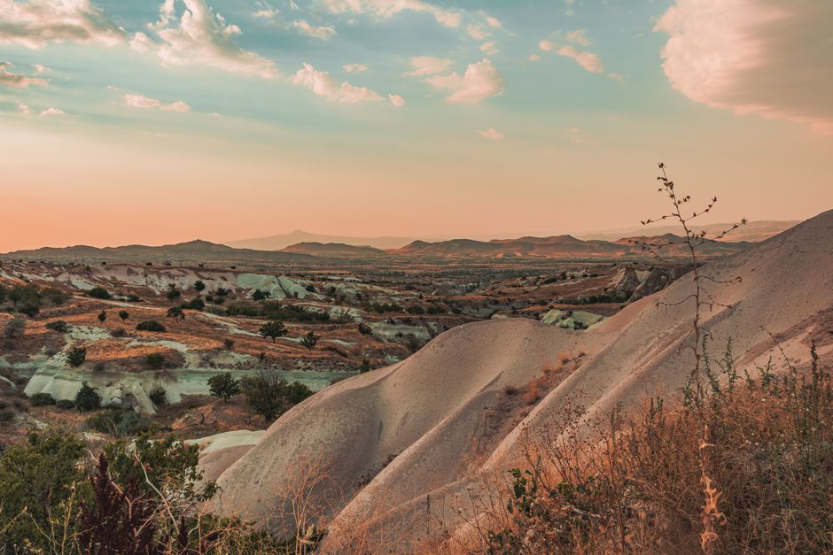 Stunning view of Cappadocia's unique landscapes during sunset in Nevşehir, Turkey.