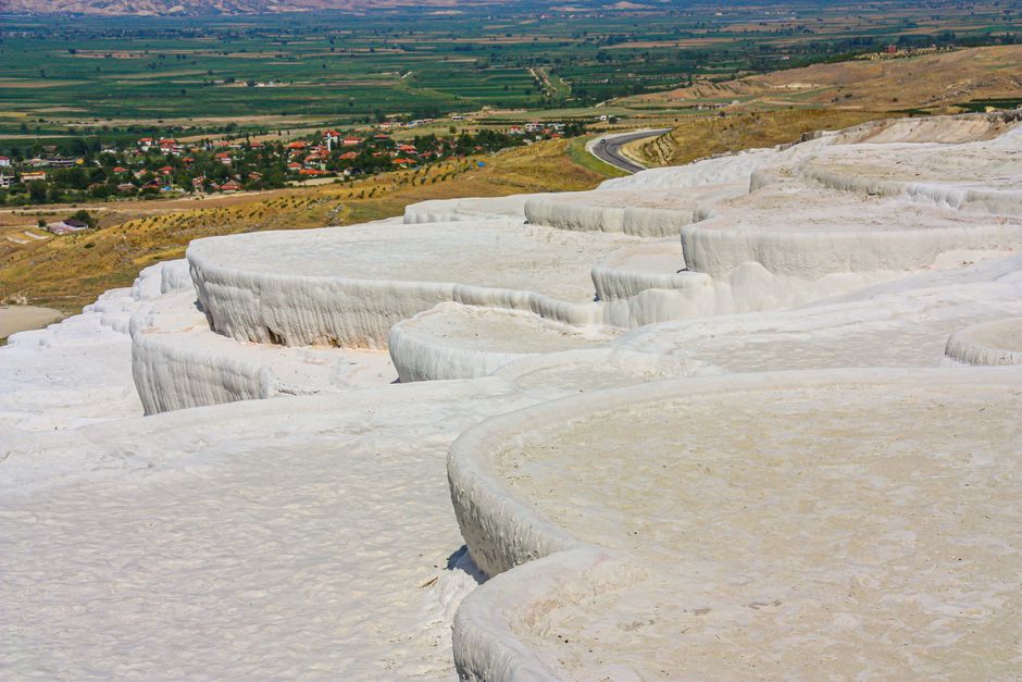 A stunning high angle view of the natural travertine terraces in Pamukkale, Turkey.